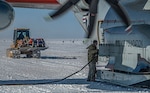 A U.S. Air Force Airman refuels a LC-130 “Skibird” assigned to the 109th Airlift Wing, New York National Guard, while it is also loaded with cargo to be delivered to a research station in Antarctica. The 109th Airlift Wing supported the 34th season of Operation Deep Freeze at McMurdo Station, Antarctica, from October 2021 through February 2022.