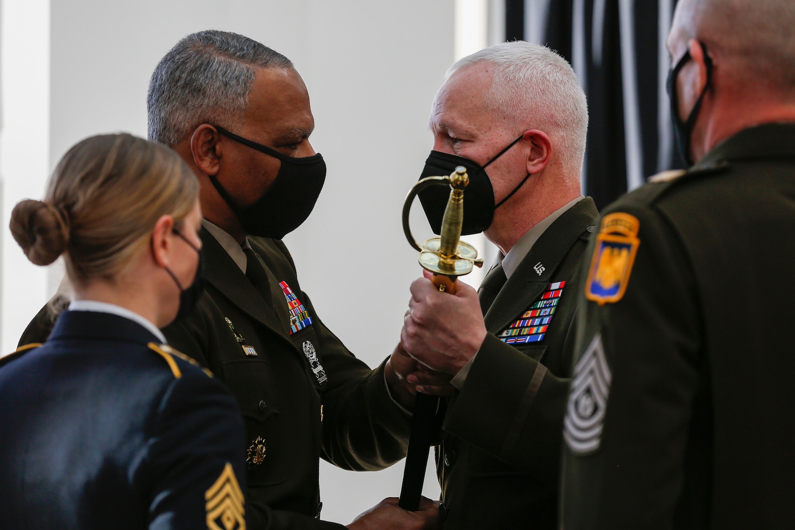 Command Sgt. Maj. John Sampa returns the sword of the noncommissioned officer to Lt. Gen. Jon Jensen, the director of the Army National Guard, signifying Sampa’s relinquishment as the Army Guard’s top senior enlisted member during a change of responsibility ceremony at the Herbert R. Temple Army National Guard Readiness Center, Arlington, Va., Feb. 9, 2022.