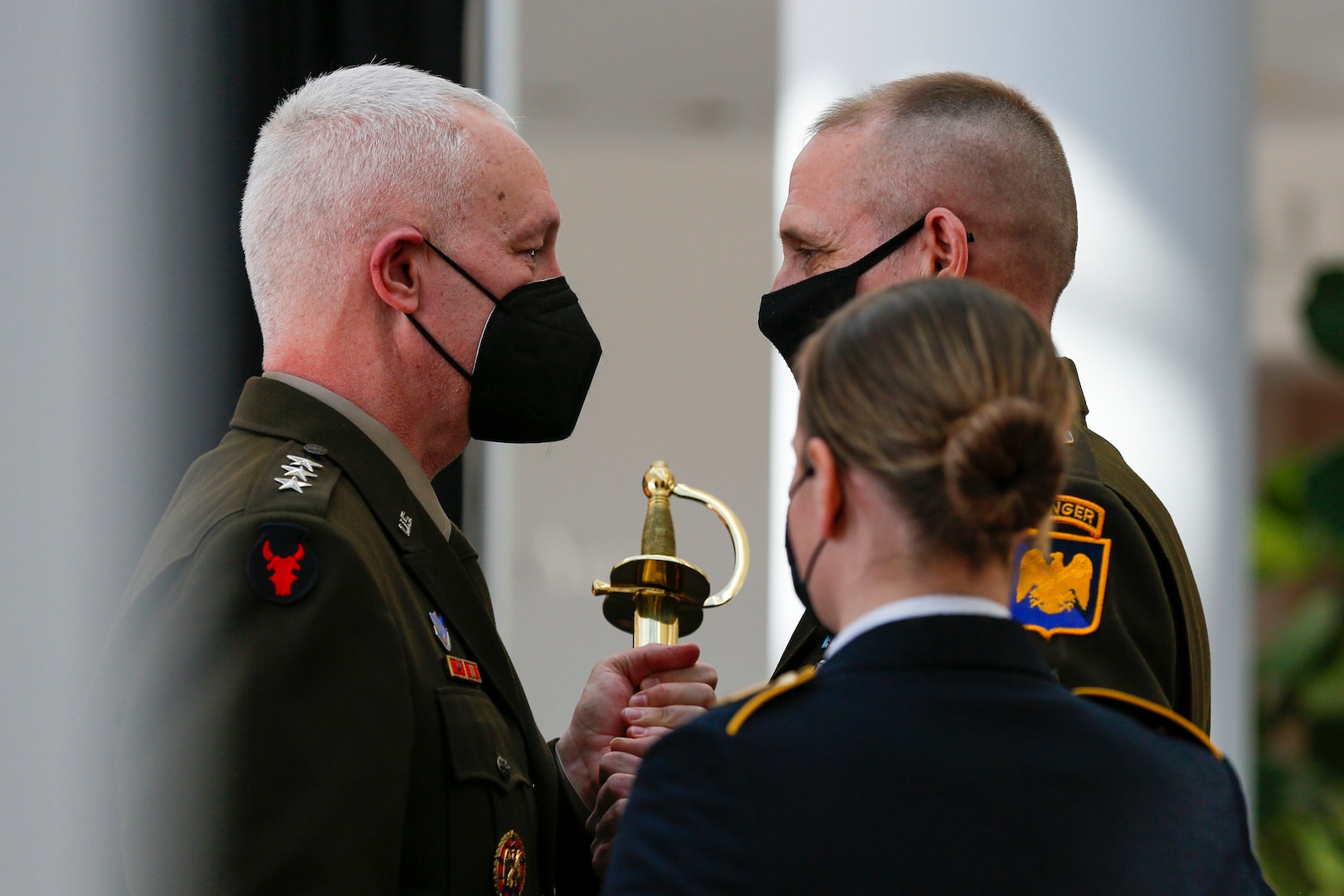 Army Lt. Gen. Jon Jensen, the director of the Army National Guard, presents the sword of the noncommissioned officer to Command Sgt. Maj. John Raines, welcoming him as the Army Guard’s top senior enlisted member during a change of responsibility ceremony at the Herbert R. Temple Army National Guard Readiness Center, Arlington, Va., Feb. 9, 2022.