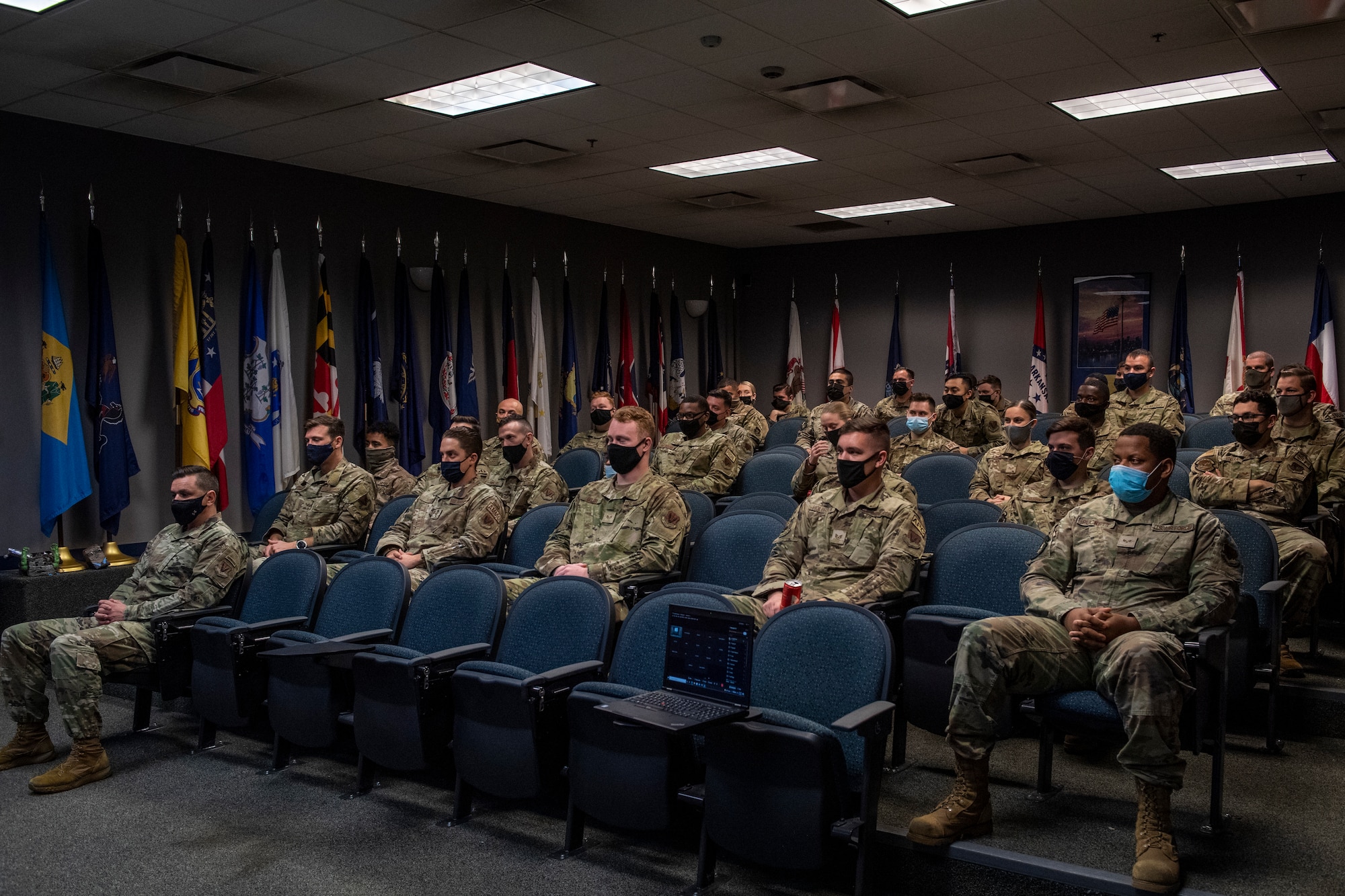 group of men in uniform sitting down