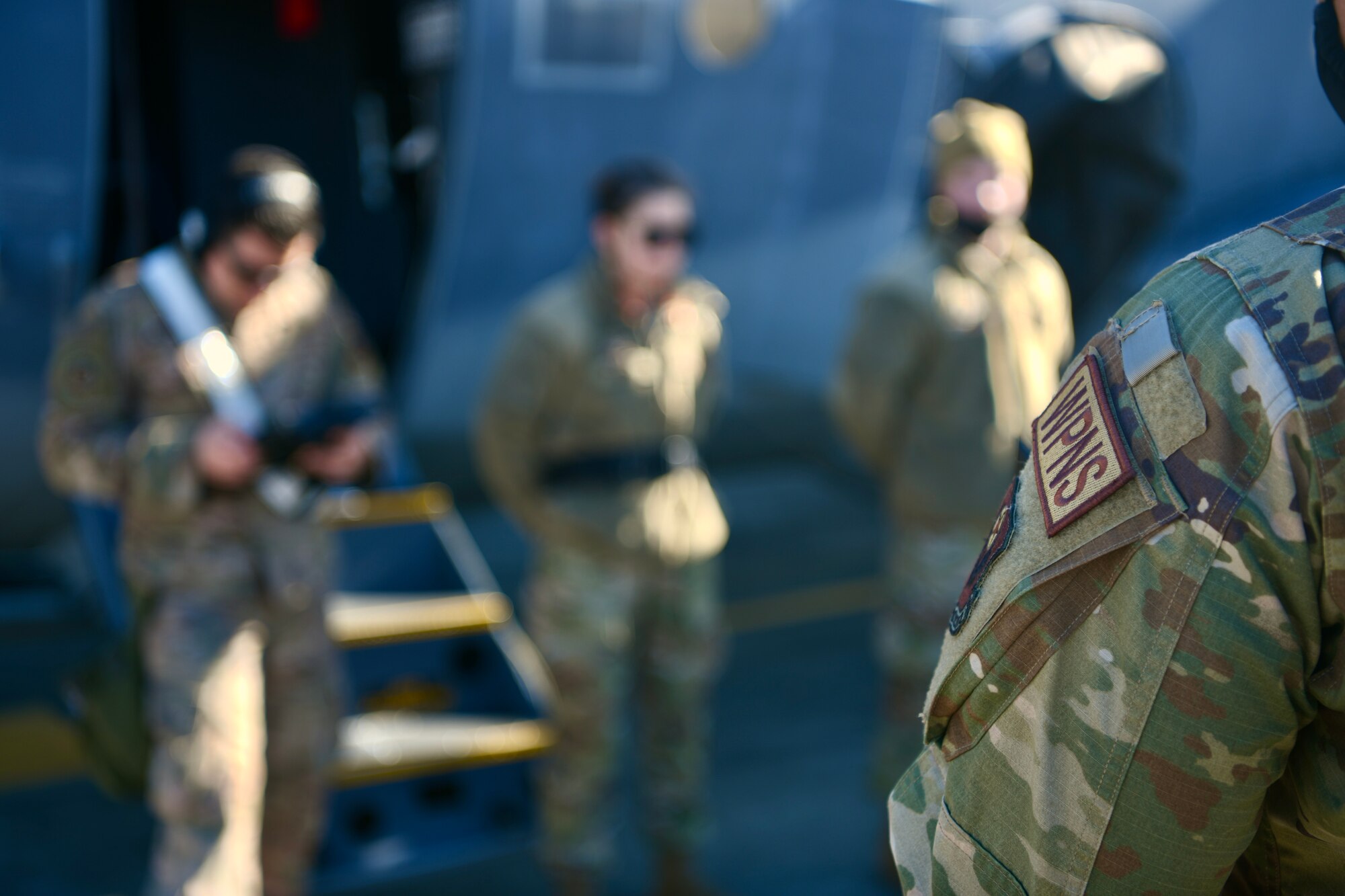 Air Commandos assigned to the 4th Aircraft Maintenance Unit stand in front of an AC-130J Ghostrider during the 1st Special Operations Wing’s Weapons Load Crew of the 4th Quarter Competition Jan. 7, 2022 on the flightline at Hurlburt Field, Florida.