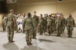 Oklahoma National Guard Capt. Coleton Crockett, commander of Alpha Company 777, 345th Combat Sustainment Support Battalion, 90th Troop Command, salutes at a ceremony to award the unit a Meritorious Unit Commendation at the Armed Forces Readiness Center, Okmulgee, Oklahoma, Feb. 5, 2022. The unit was awarded the commendation in recognition of their accomplishments during their 2016-2017 deployment to Kuwait in support of Operations Inherent Resolve, Spartan Shield, and Freedom’s Sentinel. (Oklahoma National Guard photo by Spc. Danielle Rayon)