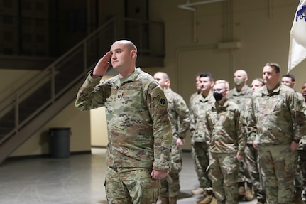 Oklahoma National Guard Capt. Coleton Crockett, commander of Alpha Company 777, 345th Combat Sustainment Support Battalion, 90th Troop Command, salutes at a ceremony to award the unit a Meritorious Unit Commendation at the Armed Forces Readiness Center, Okmulgee, Oklahoma, Feb. 5, 2022. The unit was awarded the commendation in recognition of their accomplishments during their 2016-2017 deployment to Kuwait in support of Operations Inherent Resolve, Spartan Shield, and Freedom’s Sentinel. (Oklahoma National Guard photo by Spc. Danielle Rayon)