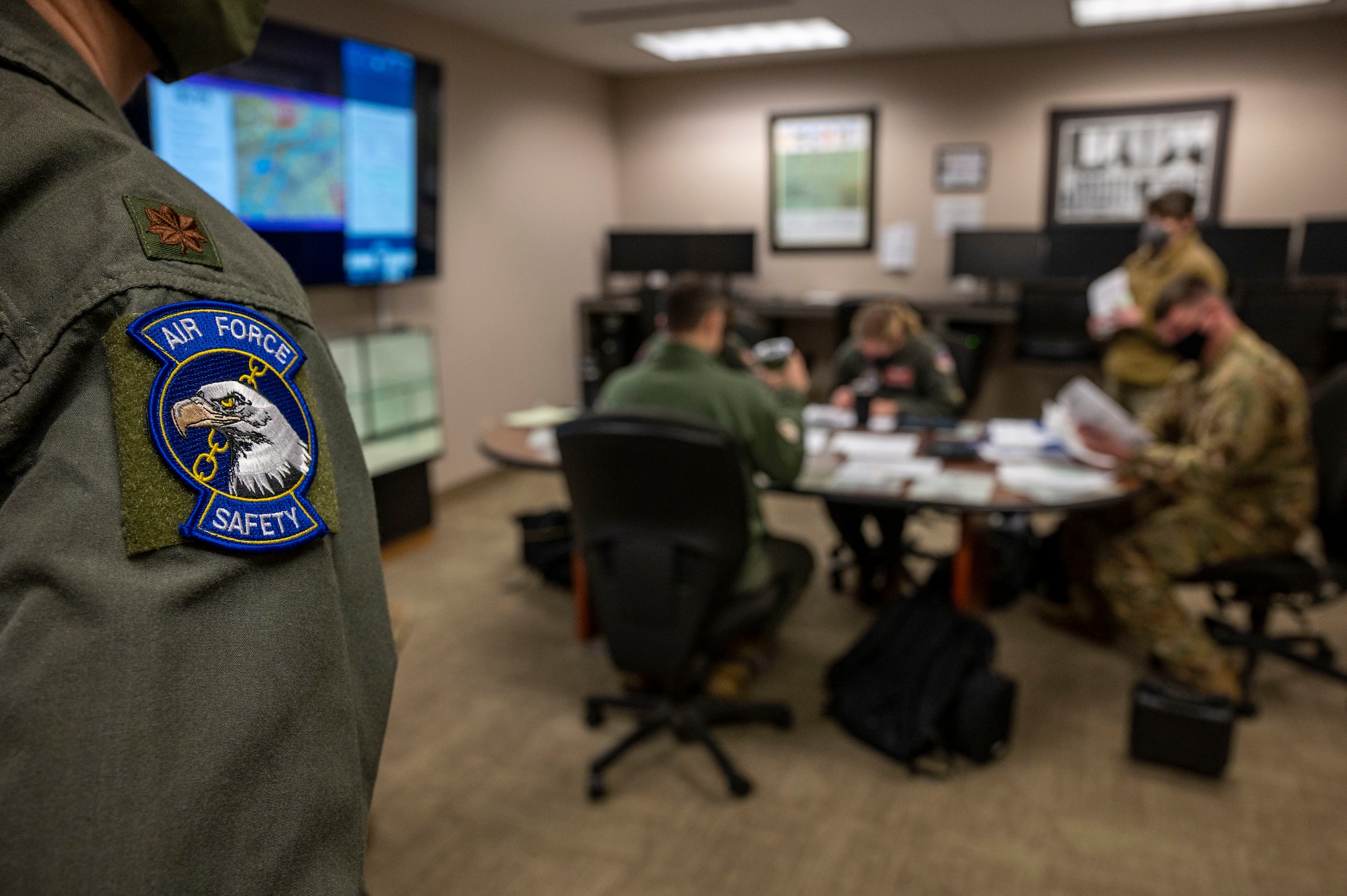 Airmen talk at table