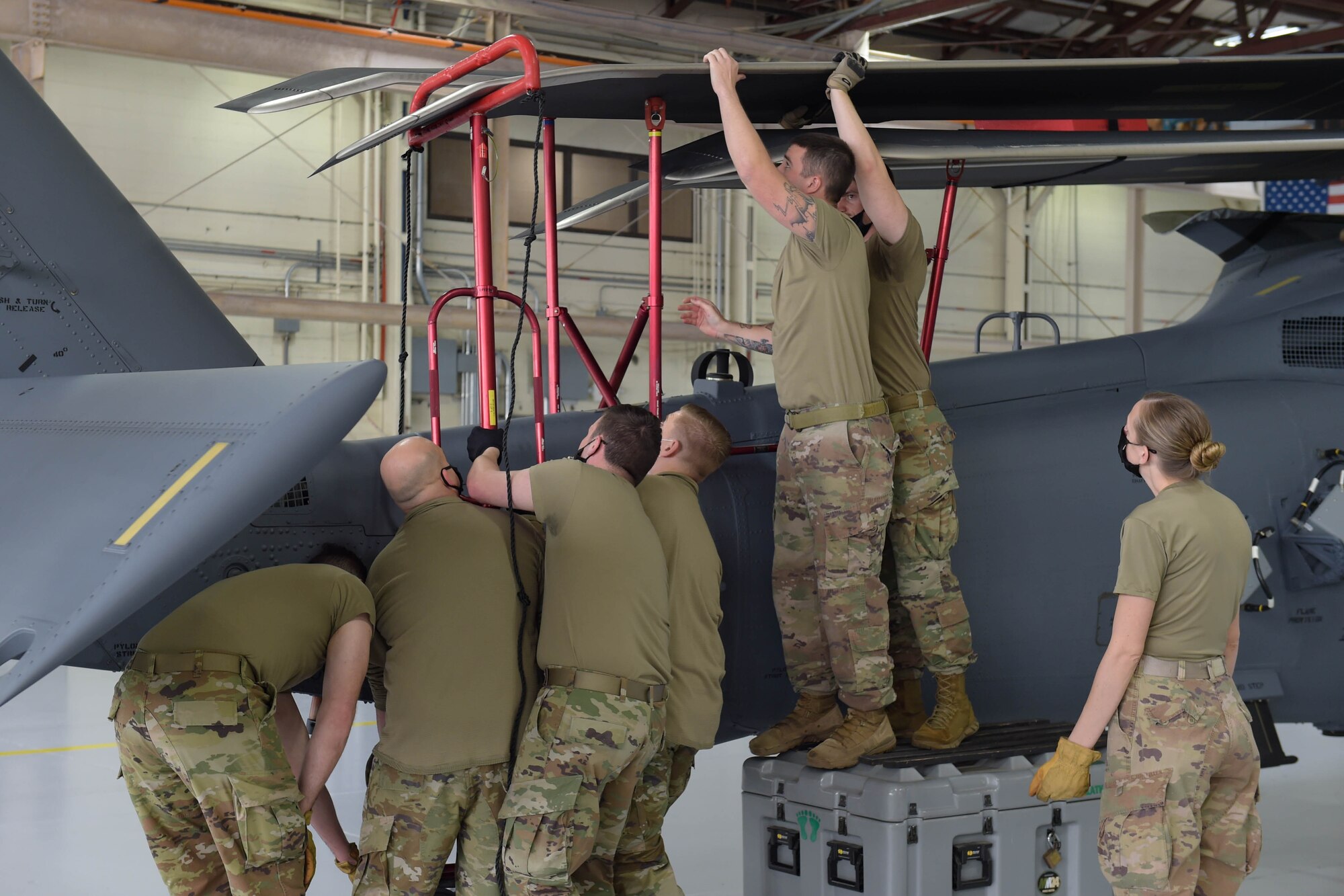 A photo of a group of Airmen working.