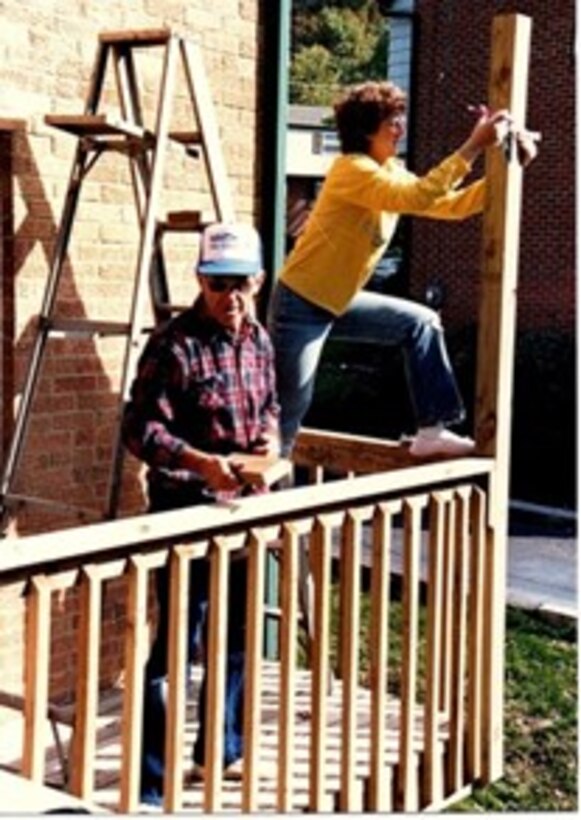 Lenna Hawkins and her father building a backyard deck at her house. (Courtesy photo)