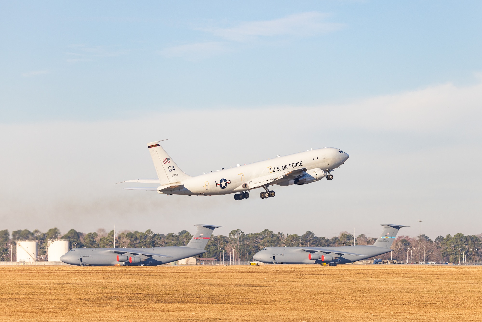 E-8C Joint STARS aircraft 92-3289 departs one last time from Robins Air Force Base, Georgia, Feb. 11, 2022. The aircraft has been in military service since 1996 and will retire to its final resting place with the 309th Aerospace Maintenance and Regeneration Group at Davis-Monthan Air Force Base, Arizona. (U.S. Air National Guard photo by Tech. Sgt. Jeff Rice)