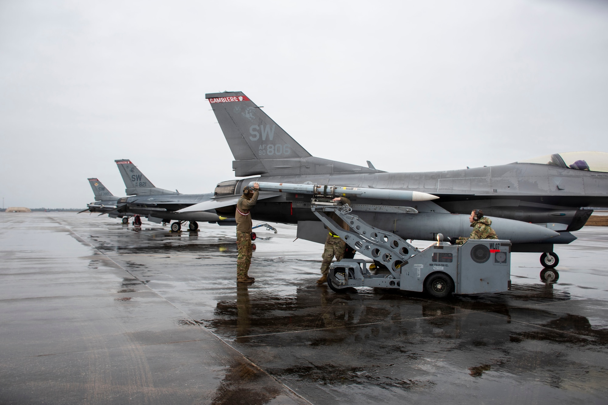 Maintainers assigned to the 77th Fighter Squadron, Shaw Air Force Base, South Carolina, load an Advanced Medium-Range Air-to-Air Missile on to a U.S. Air Force F-16 Fighting Falcon as part of the 53rd Weapons Evaluation Group’s Weapons System Evaluation Program East 22.04, hosted at Tyndall Air Force Base, Florida, Jan. 25, 2022. During WSEP, units across the Department of Defense are evaluated on air-to-air combat capabilities. (U.S. Air Force photo by 1st Lt Lindsey Heflin)