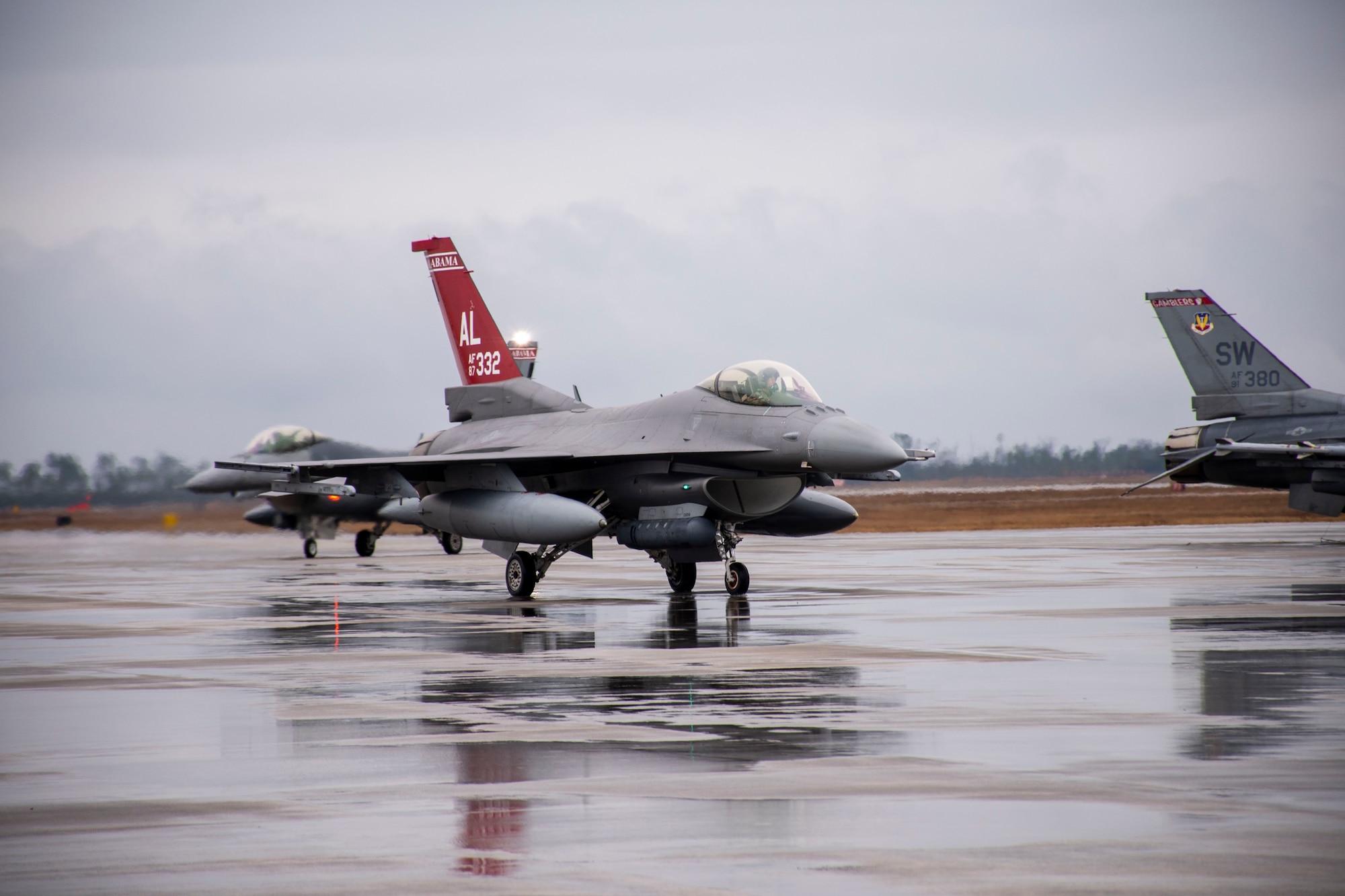 Two U.S. Air Force F-16 Fighting Falcon “Red Tails” attached to the 100th Fighter Squadron, Dannelly Field, Alabama arrive to Tyndall Air Force Base, Florida to participate in the 53rd Weapons Evaluation Group’s Weapons System Evaluation Program East 22.04, Jan. 25, 2022. During WSEP, units across the Department of Defense are evaluated on air-to-air combat capabilities. (U.S. Air Force photo by 1st Lt Lindsey Heflin)