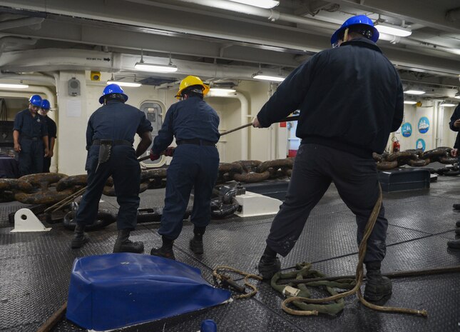 Sailors make preparations to drop anchor in the foc'sle of the Nimitz-class aircraft carrier USS Harry S. Truman (CVN 75), Feb. 11, 2022.