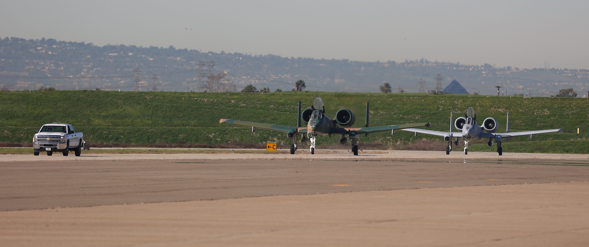 A U.S. Air Force A-10C Warthog II from the A-10C Thunderbolt II Demonstration Team, lands on Los Alamitos Army Airfield, Feb. 8, 2022, at Joint Forces Training Base, Los Alamitos, California. Five aircraft representing the Air Force’s 75 years as a service will perform a first-of-its-kind flyover of Super Bowl LVI in nearby Inglewood. Flyover aircraft are staging at the California National Guard base in the days leading up to the game. (U.S. Air National Guard photo by Staff Sgt. Crystal Housman)