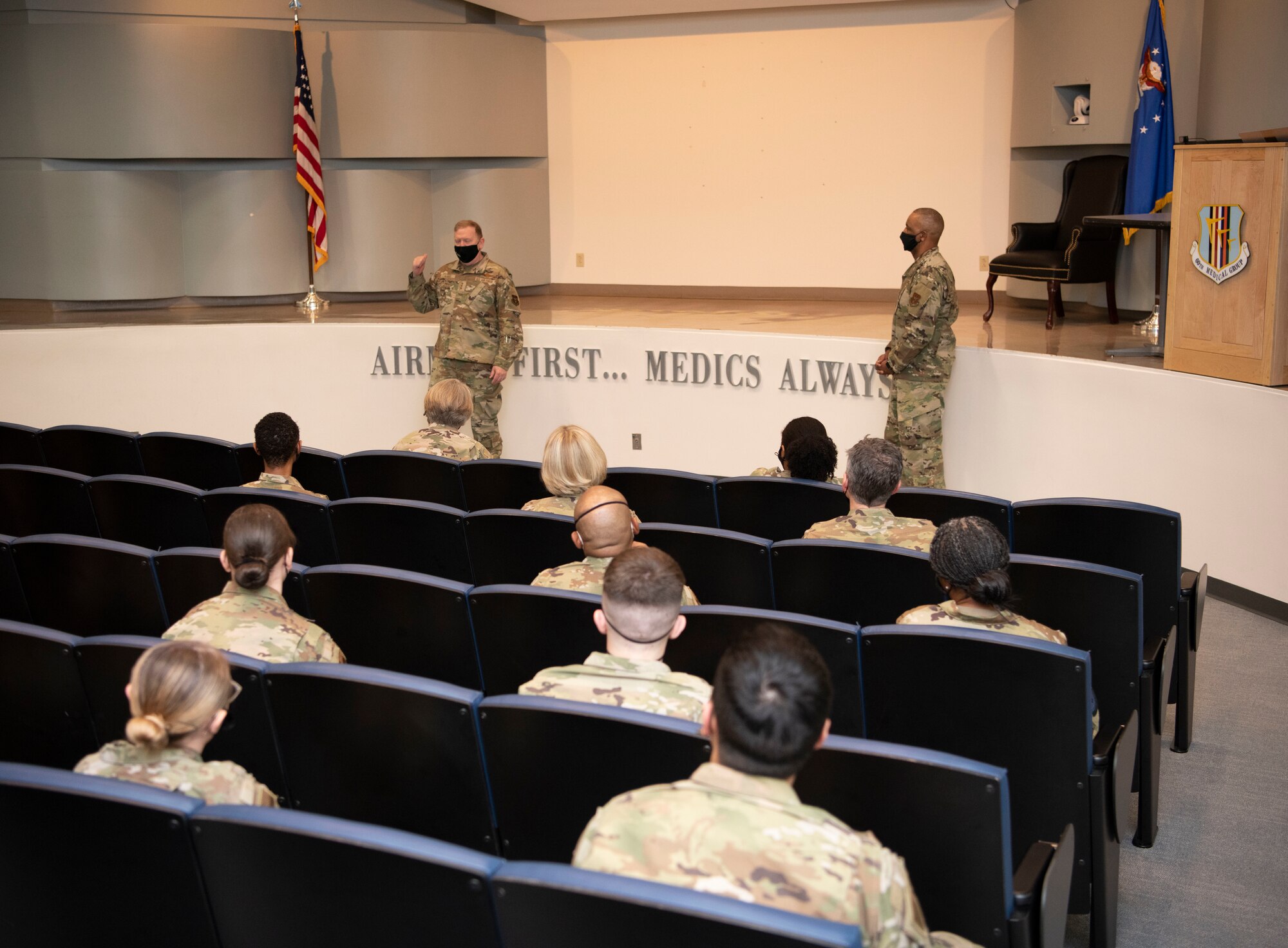 Lt. Gen. Richard W. Scobee, chief of the Air Force Reserve and commander of the Air Force Reserve Command, and Chief Master Sgt. Timothy C. White Jr., senior enlisted Advisor to the Chief of Air Force Reserve and command chief of Air Force Reserve Command, speak with members of the 349th Mecdical Group at Travis Air Force Base, California, Feb. 12, 2022. During the visit, Scobee and White leasrned about Reserve Citizen Airmen support of COVID-19 operations nationwide.