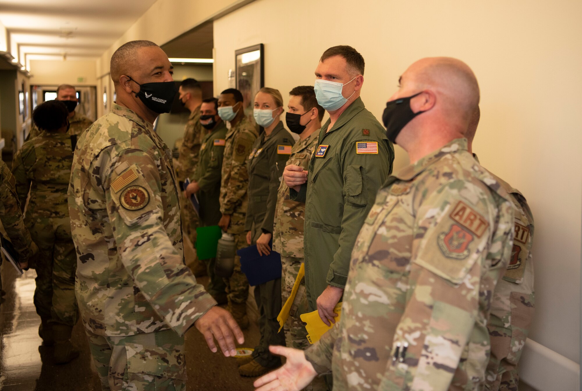 Chief Master Sgt. Timothy C. White Jr., senior enlisted advisor to the Chief of Air Force Reserve and Command chief of Air Force Reserve Command, greets members of the 349th Medical Group at Travis Air Force Base, California, Feb. 12, 2022. The opportunity allowed the 349th Ait Mobility Wing to showcase its people, mission, accomplishments, and innovation efforts.