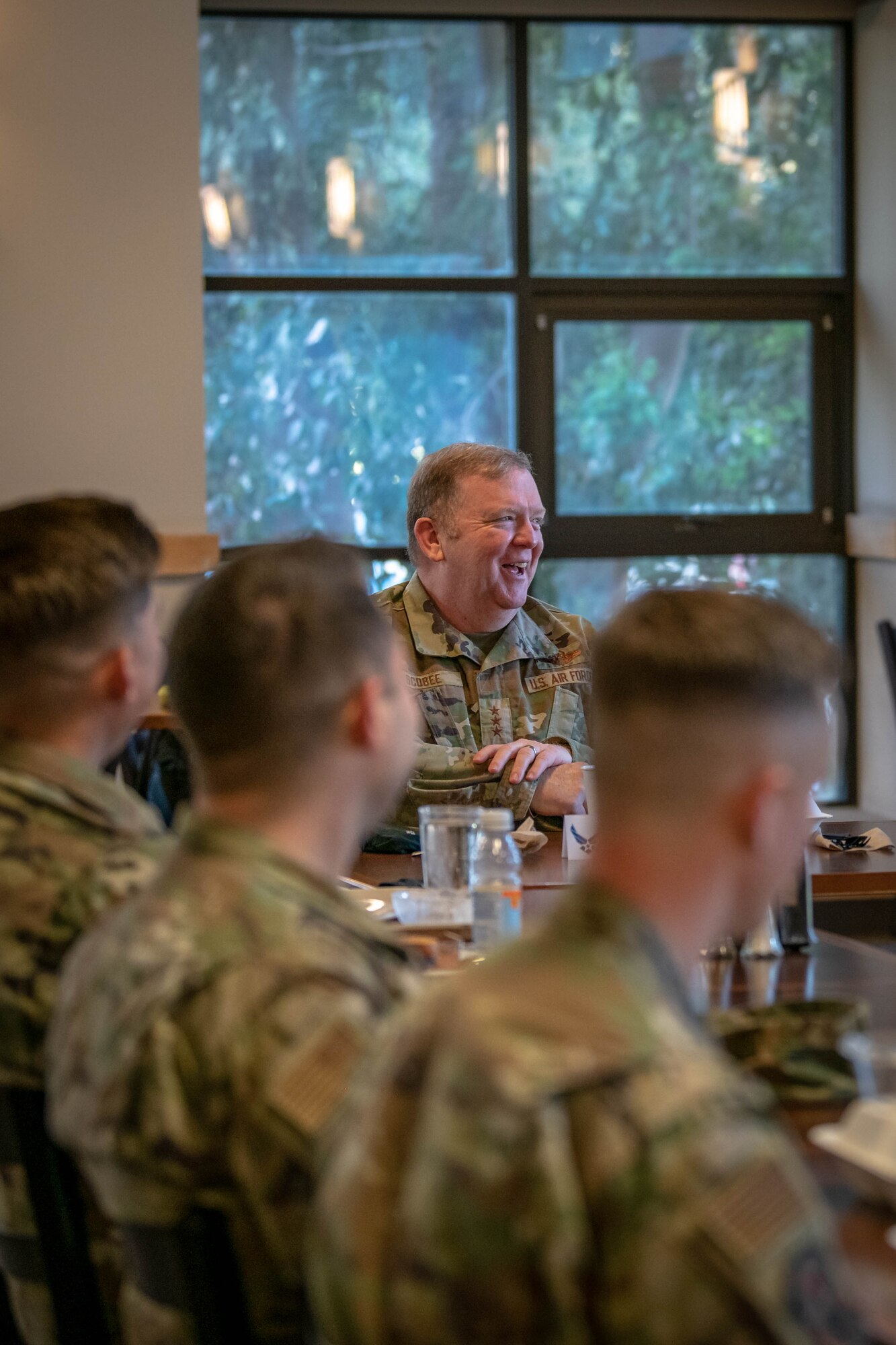Lt. Gen. Richard W. Scobee, chief of the Air Force Reserve and commander of the Air Force Reserve Command, sits down and shares stories with members of the 349th Air Mobility Wing, at Travis Air Force Base, California, Feb. 12 2022. The opportunity allowed Scobee to meet with Reserve Citizen Airmen