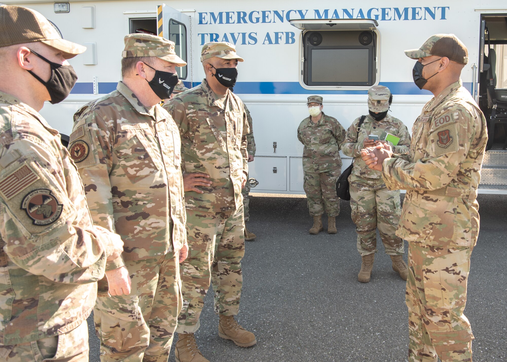 Master Sgt. Kyle Spalding, 349th Civil Engineer Squadron explosive ordnance disposal technician, briefs Lt. Gen. Richard W. Scobee, chief of the Air Force Reserve and commander of the Air Force Reserve Command, and Chief Master Sgt. Timothy C. White Jr., senior enlisted advisor to the Chief of Air Force Reserve and command chief of Air Force Reserve Command, at Travis Air Force Base, Feb. 12, 2022.  Following the briefing, Scobee and White participated in a detonation cord blast demonstration.