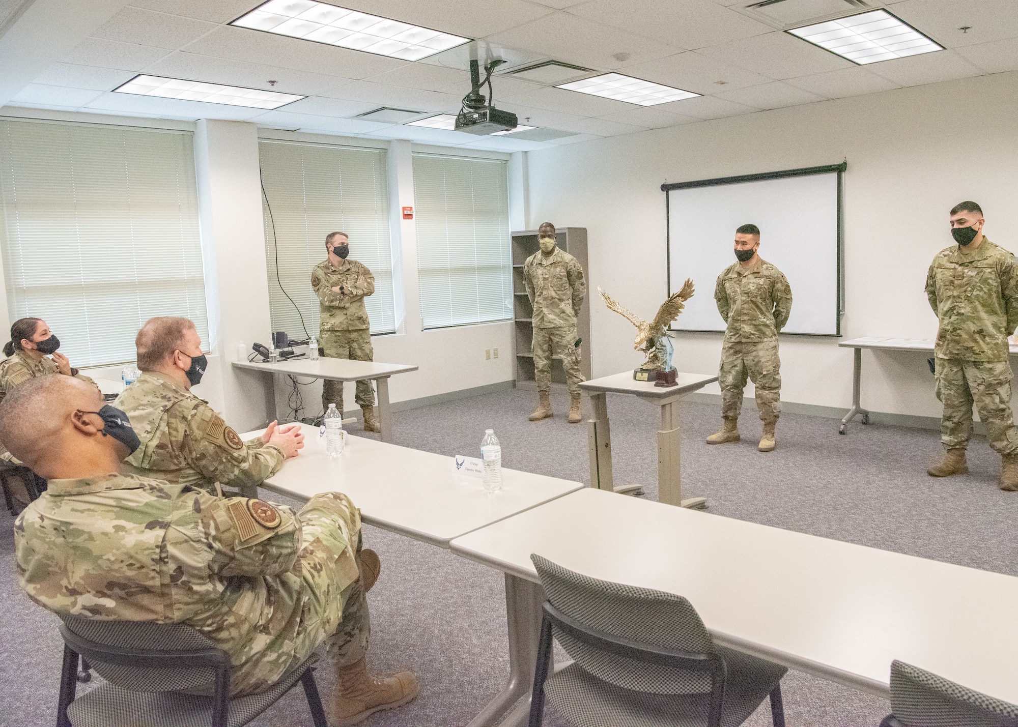 Lt. Gen. Richard W. Scobee, chief of the Air Force Reserve and commander of the Air Force Reserve Command, and Chief Master Sgt. Timothy C. White Jr., senior enlisted advisor to the Chief of Air Force Reserve and command chief of Air Force Reserve Command, learn why the 349th Security Forces Squadron was named the AFRC Large Tenant Unit of the Year during a visit to Travis Air Force Base, California, Feb. 12, 2022. Scobee and White visited the 349th Air Mobility Wing to learn more about its people, mission, accomplishments, and innovation efforts.