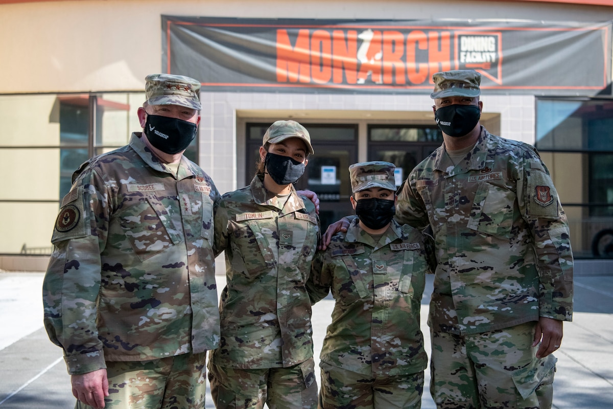 Lt. Gen. Richard W. Scobee, chief of the Air Force Reserve and commander of the Air Force Reserve Command, and Chief Master Sgt. Timothy C. White Jr., senior enlisted advisor to the Chief of Air Force Reserve and command chief of Air Force Reserve Command, pose for a photo with Senior Airman Maria Moya, 349th Force Support Squadron, and Airman Ericka Tomlin, 349th Medical Group, at Travis Air Force Base, California, Feb. 12, 2022. Moya and Tomlin were part of a group of young Reserve Citizen Airmen who had lunch with the AFRC leadership.