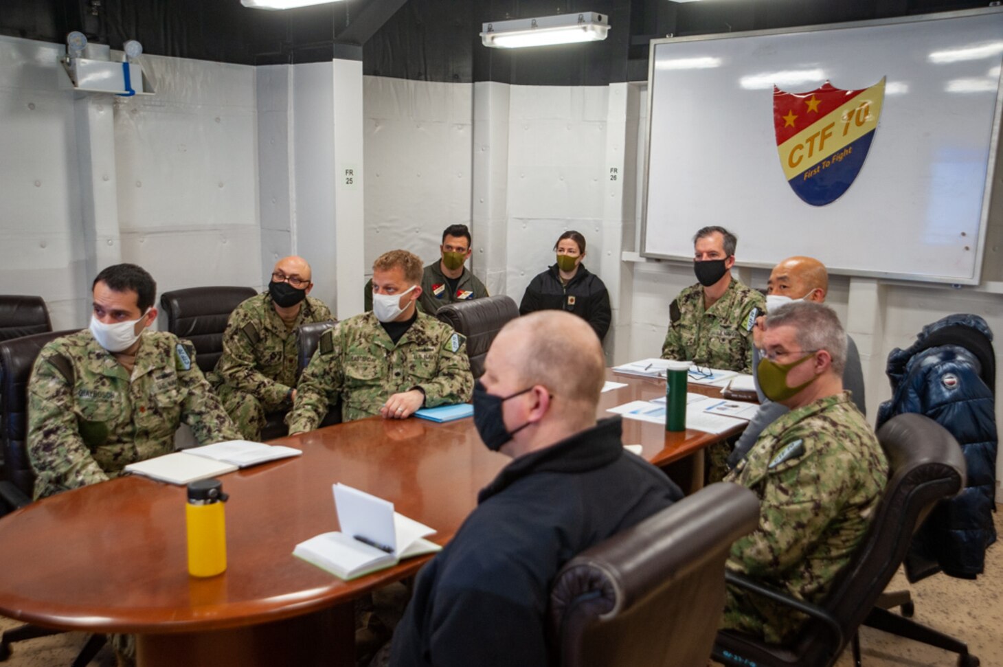 YOKOSUKA, Japan (Feb. 9, 2022) - Rear Adm. Michael Donnelly, Commander, Task Force 70, back-center, and CTF 70 staff members participate in the 30th U.S.-Republic of Korea Composite Warfare Commander Meeting, via teleconference from Yokosuka Naval base, to discuss maritime strategy and interoperability between the partner nation’s navies, Feb. 9. CTF 70 is forward-deployed to the U.S. 7th Fleet area of operation in support of a free and open Indo-Pacific. (U.S. Navy photo by Mass Communication Specialist 2nd Class Askia Collins)