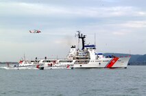 CAPE DISAPPOINTMENT, Wash. (Feb. 13, 2003)--The 52-foot motor lifeboats Intrepid and Triumph II escort the Coast Guard Cutter Steadfast during its return to port. Feb. 13, 2003. USCG photo by PA3 Kurt Fredrickson