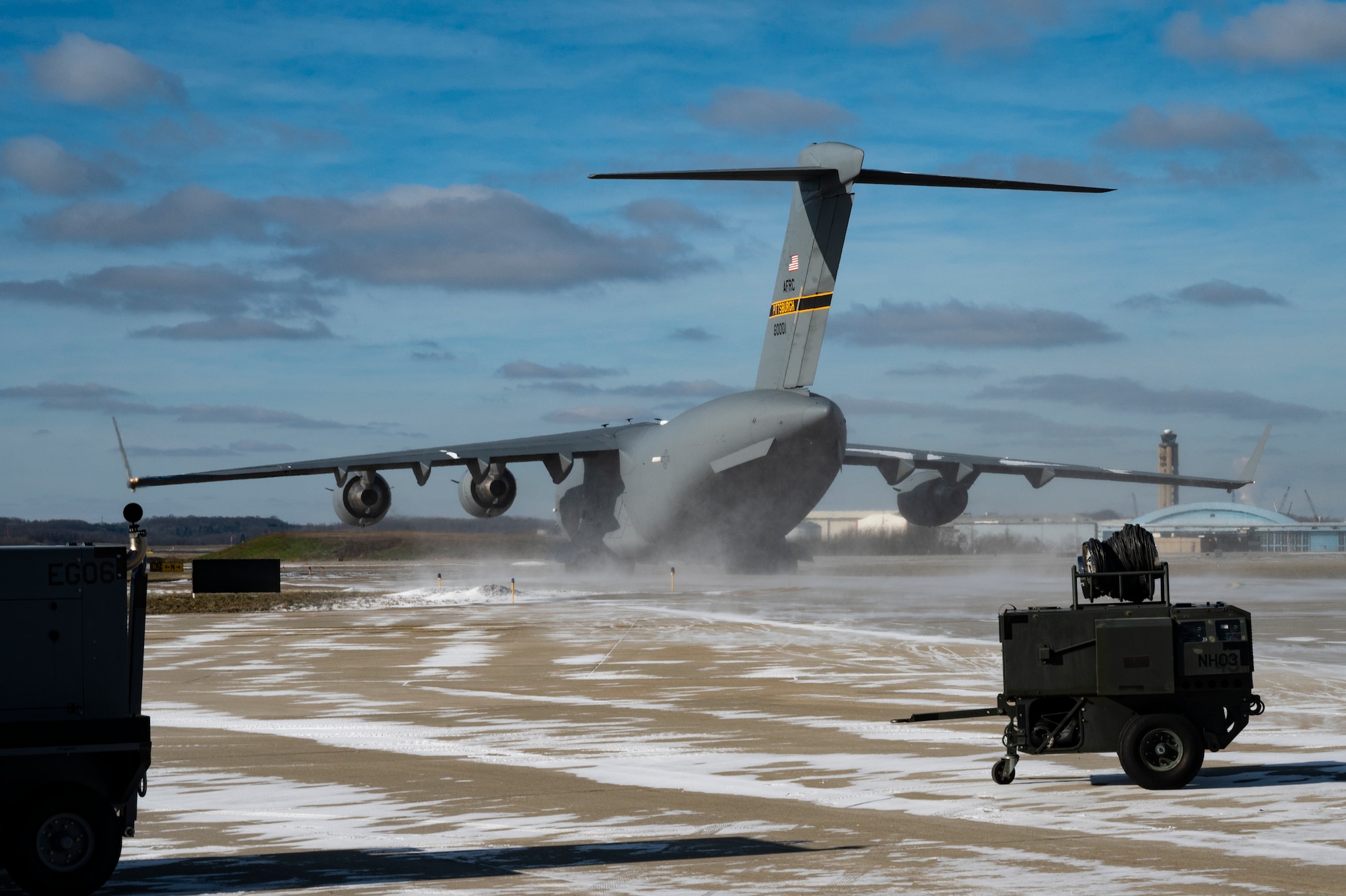 A C-17 Globemaster III taxis onto a runway while preparing to takeoff at the Pittsburgh International Airport Air Reserve Station, Pennsylvania, Jan. 11, 2022. The C-17 is capable of rapid strategic delivery of troops and all types of cargo to main operating bases or directly to forward bases in the deployment area.