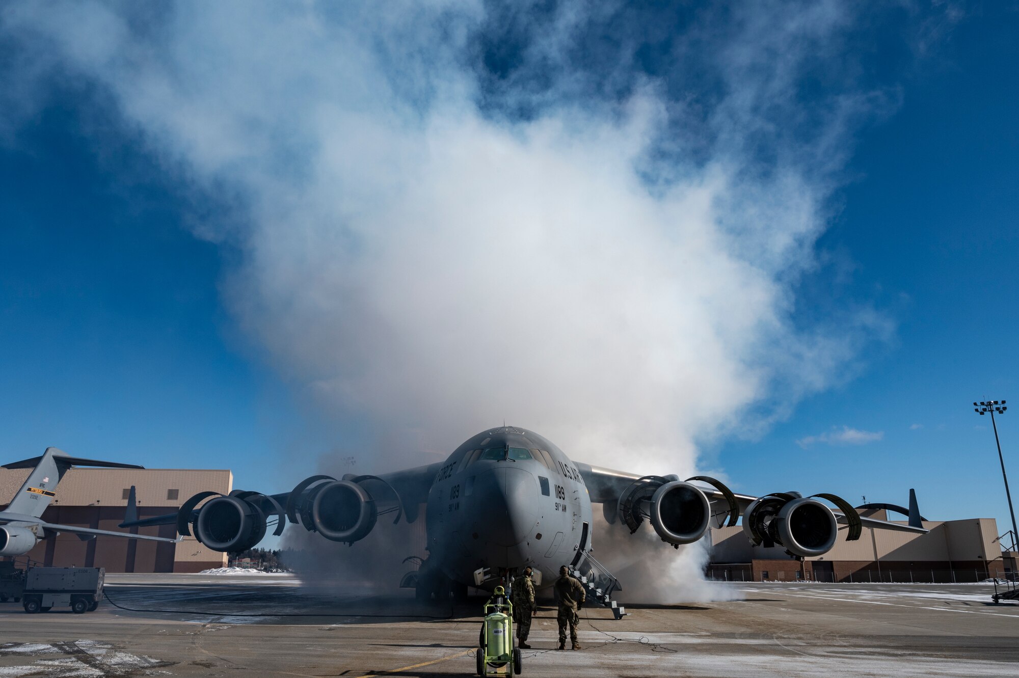 Airmen assigned to the 911th Maintenance Group conduct an engine depreservation run on a C-17 Globemaster III at the Pittsburgh International Airport Air Reserve Station, Pennsylvania, Jan. 21, 2022.