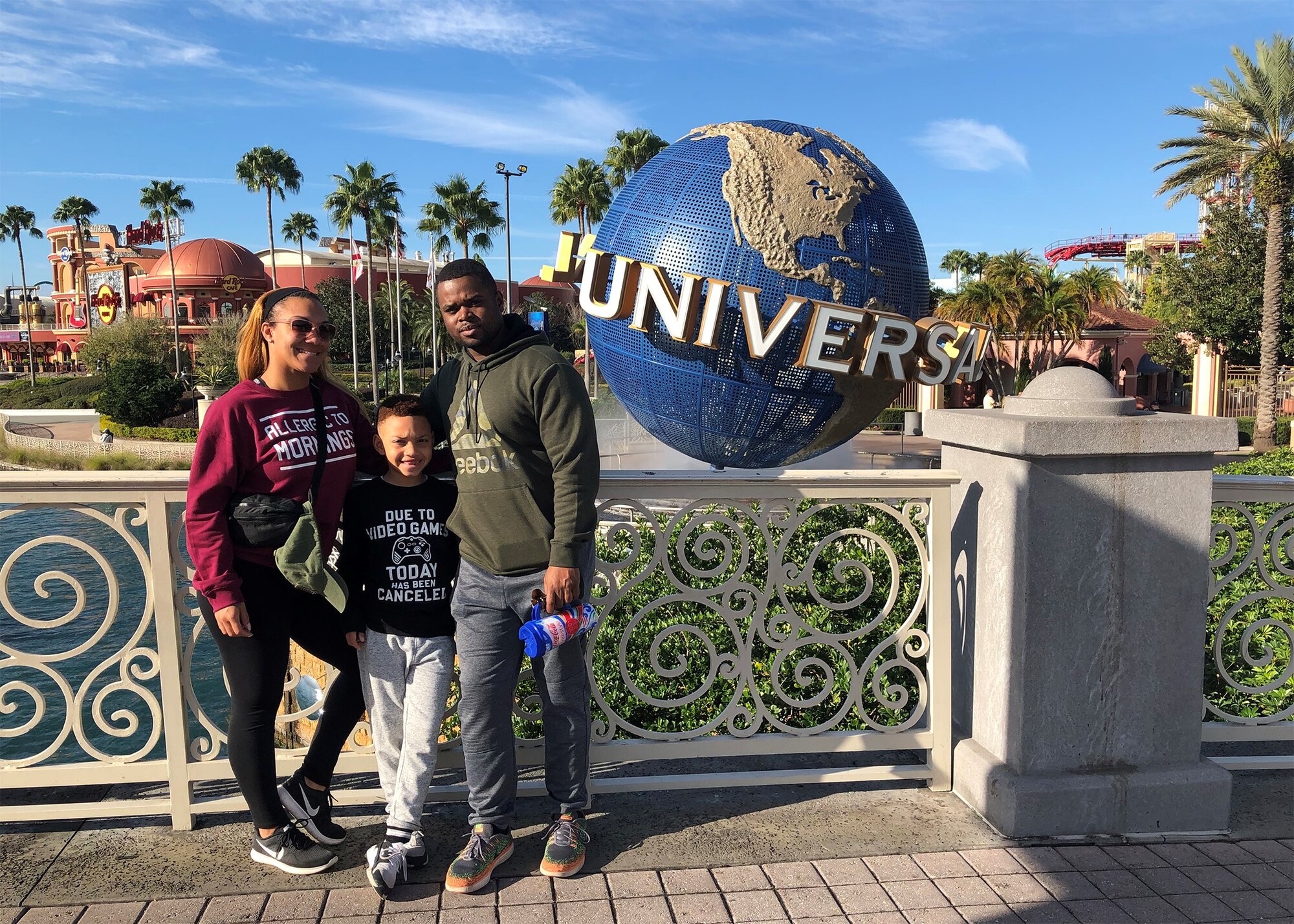 Technical Sergeants David and Ashley Bryant pose for a photo with their son while on family vacation at Universal Studios in Florida, Jan. 12, 2020. The mil-to-mil couple takes a family vacation once a year in order to maintain a healthy work/life balance. (Courtesy Photo)