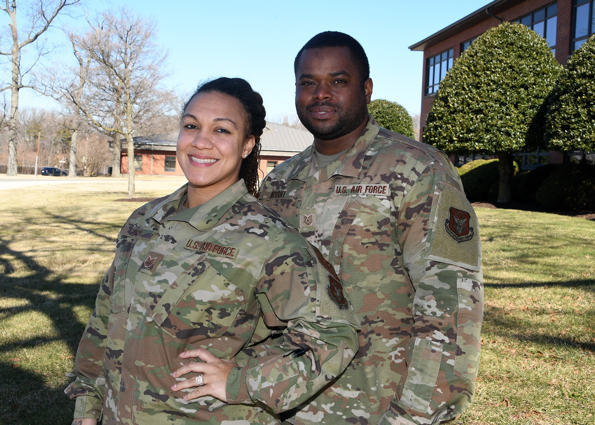 Technical Sergeants Ashley Bryant, 459th Aerospace Medicine Squadron Line of Duty Program and Case Manager, and TSgt. David Bryant, 459th Air Refueling Wing Safety Office Occupational Safety Technician, pose for a photo Feb. 9, 2022, at Joint Base Andrews, Md. The mil-to-mil couple has been serving together at the wing since 2019. (U.S. Air Force photo by Staff Sgt. Cierra Presentado)