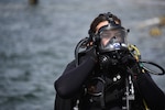 Petty Officer 2nd Class Monique Gilbreath prepares to take part in a diving exercise at Coast Guard Sector San Diego, March 25, 2021. Gilbreath is one of two active female divers in the Coast Guard. (U.S. Coast Guard photo by Petty Officer 3rd Class Alex Gray)