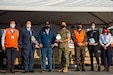 Guatemala City, Guatemala - U.S. Marine Corps Lt. Col. Jacob Reeves, the Joint Task Force-Bravo chief of staff, center, receives an award from Alejandro Eduardo Giammattei Falla, the President of Guatemala, during the closing ceremony of the Coordination Center for Natural Disaster Prevention in Central America and Dominican Republic (CEPREDENAC) II Regional Humanitarian Assistance Drill in Guatemala City, Guatemala, Feb. 4, 2022. JTF-Bravo participated in the CEPREDENAC drill through observation and an aerial firefighting exercise to build partnerships and coordination during natural disasters in the joint operating area.