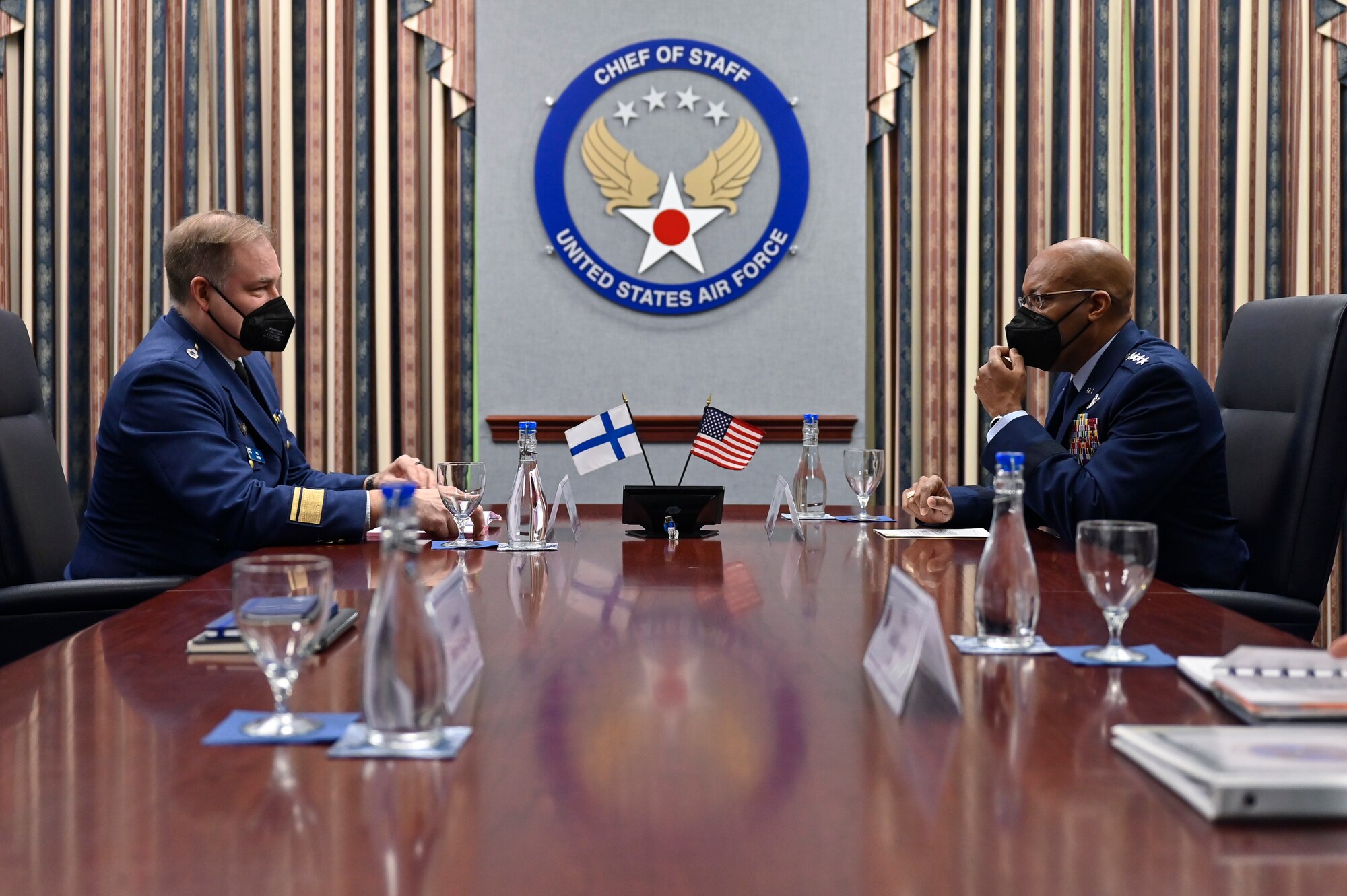 Air Force Chief of Staff Gen. CQ Brown, Jr., right, speaks with Maj. Gen. Pasi Jokinen.