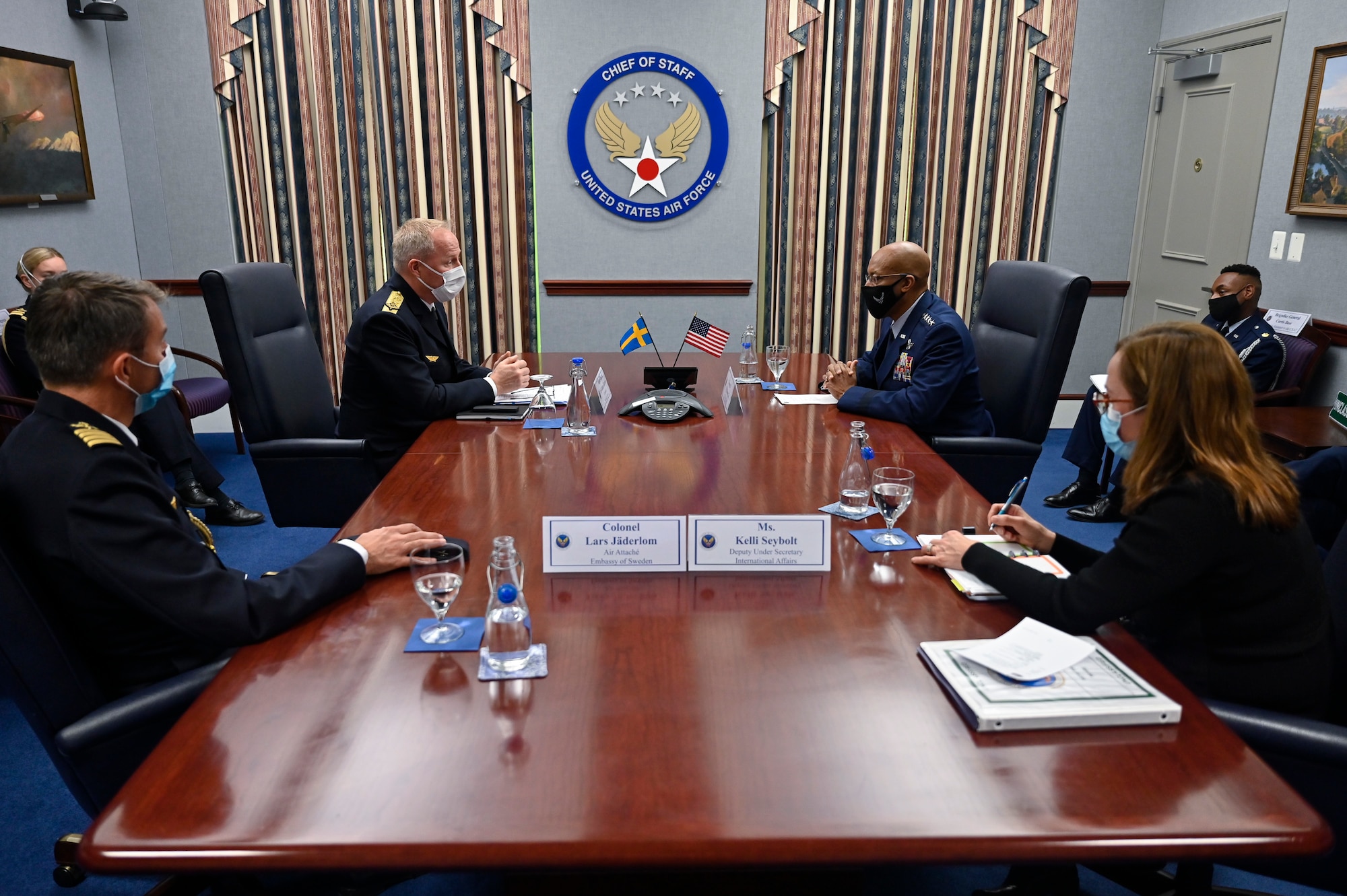 Maj. Gen. Carl-Johan Edstrom, center left, commander of the Swedish Air Force, speaks with Air Force Chief of Staff Gen. CQ Brown, Jr.