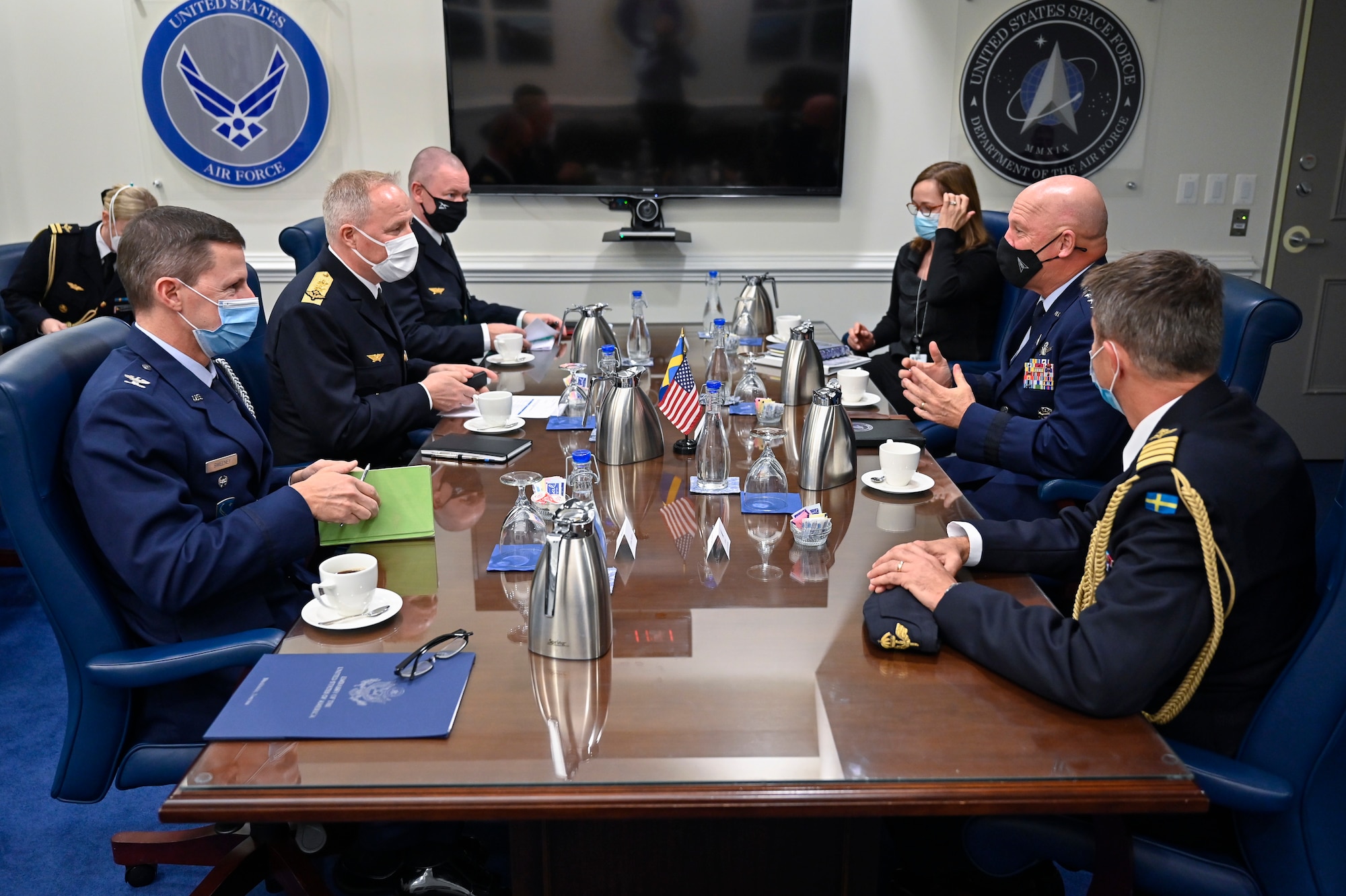 Chief of Space Operations Gen. John W. “Jay” Raymond, center right, speaks with Maj. Gen. Carl-Johan Edstrom.