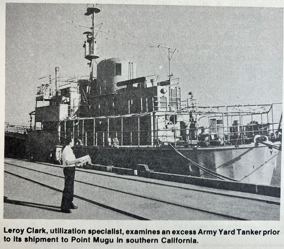 A man observes a small ship.