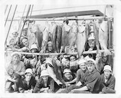 Cutter crew displays their catch of fish