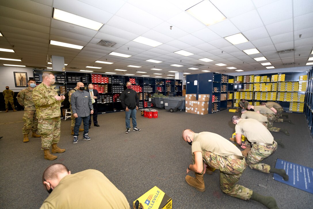 soldiers try on shoes