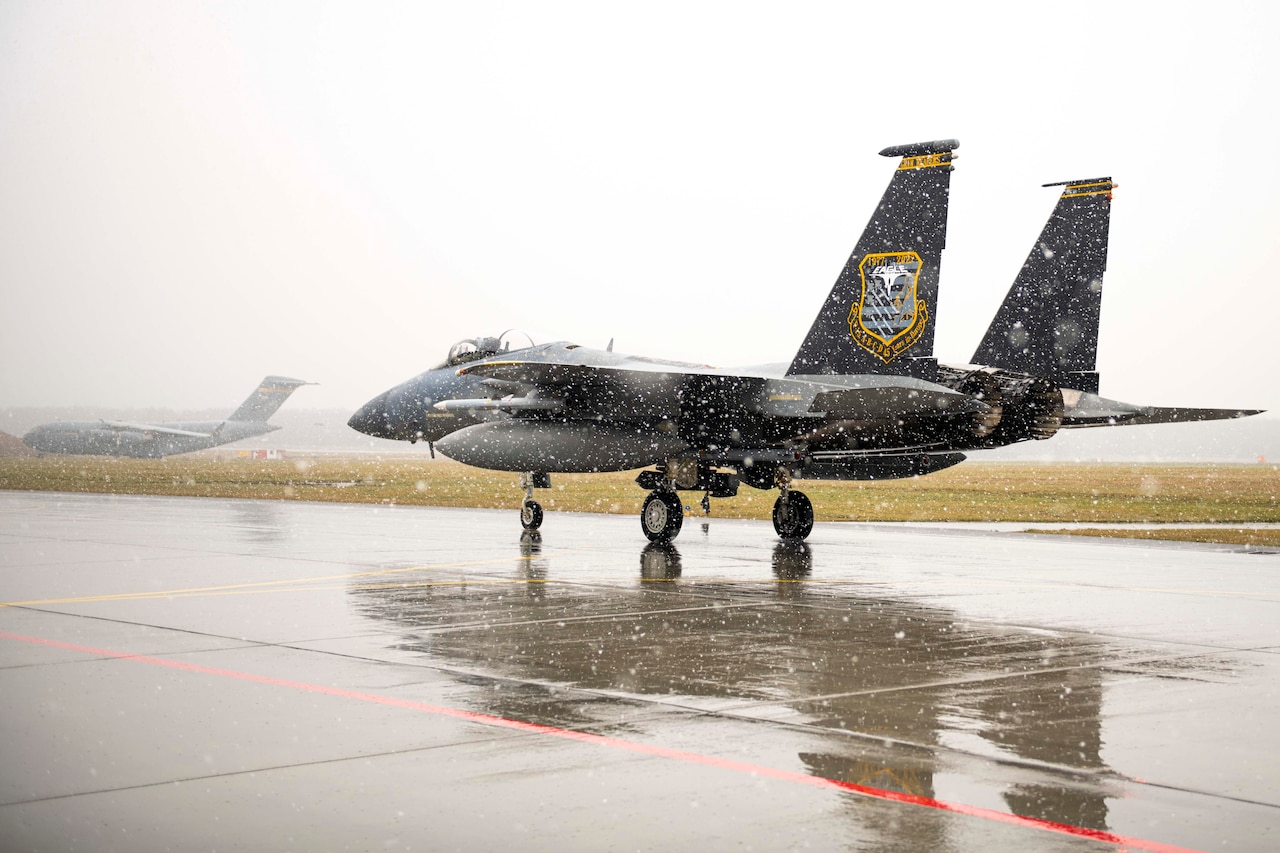 A plane taxis on a runway.