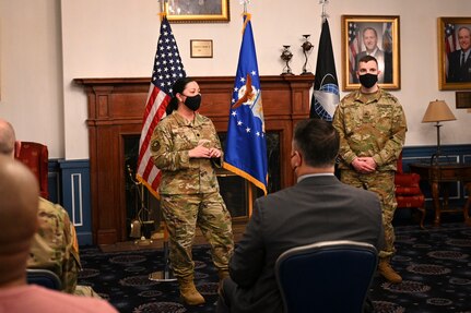 U.S. Air Force Lt. Col. Jane Dunn, 11th Force Support Squadron commander, officiates a ceremony for U.S. Army Sgt. Harly D. Gomme as he transfers into the U.S. Space Force in a ceremony.