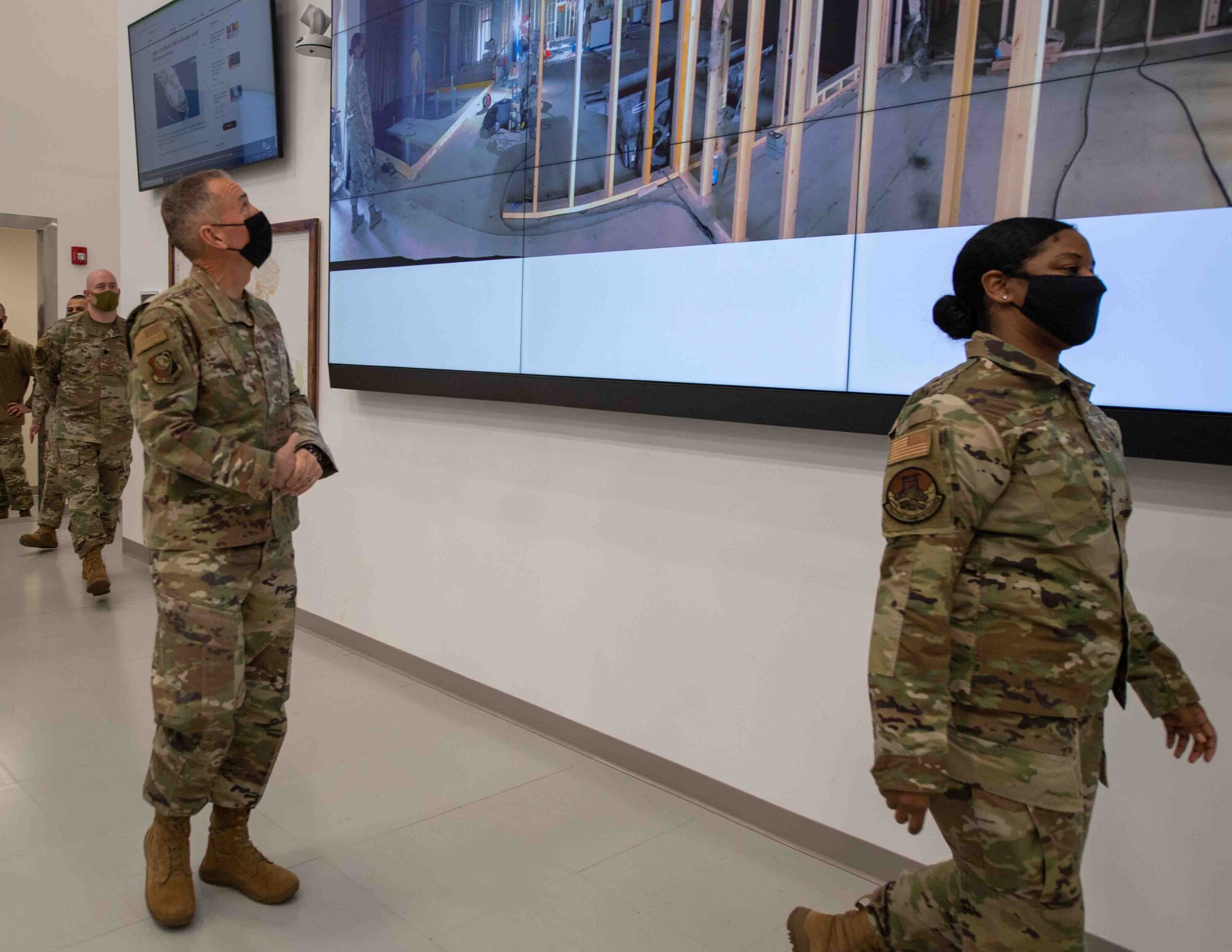 Maj. Gen. Tom Wilcox, Air Force Installation and Mission Support Center commander, looks at images of Yokota’s Emergency Operations Center renovation during a site visit at Yokota Air Base, Japan, Feb. 9, 2022.