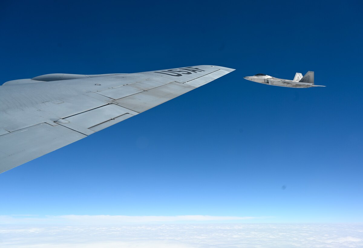 A jet flies by a jet