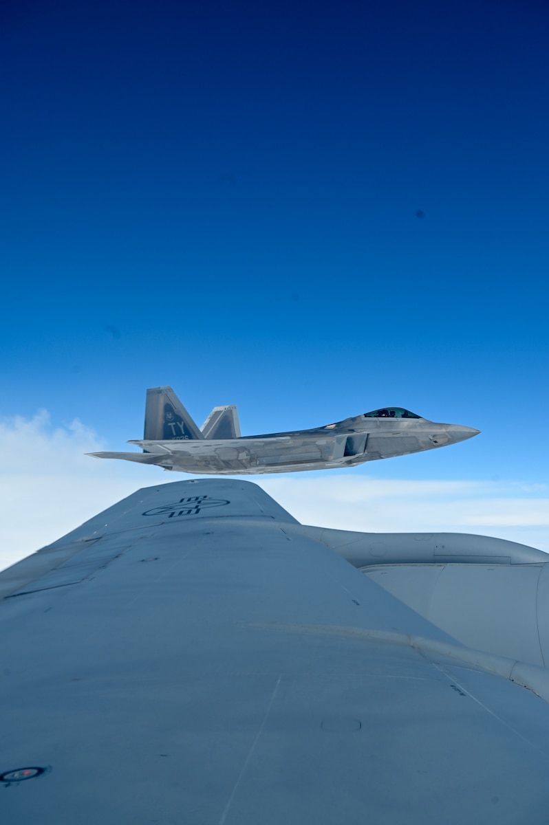 Jet flies by a jet