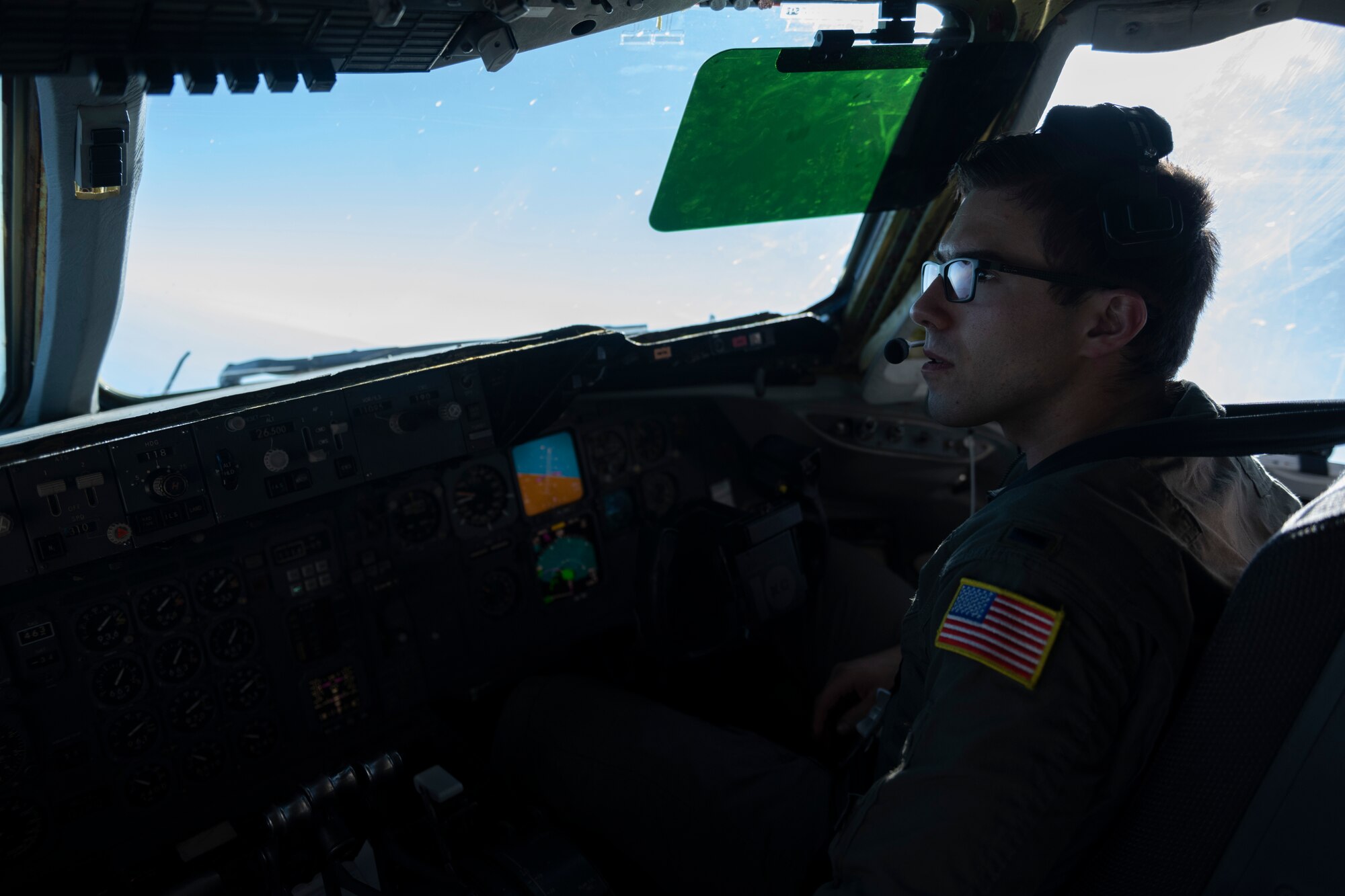 U.S. Air Force 1st Lt. Nathan Amaral, 9th Air Refueling Squadron pilot, flies a KC-10 Extender assigned to the 60th Air Mobility Wing, during Super Bowl LVI Feb. 13, 2022, above Los Angeles. A KC-10 Extender provides 83,000 pounds of fuel to three F-15E Strike Eagles over the course of Super Bowl LVI, so they can provide security. (U.S. Air Force photo by Senior Airman Cameron Otte)