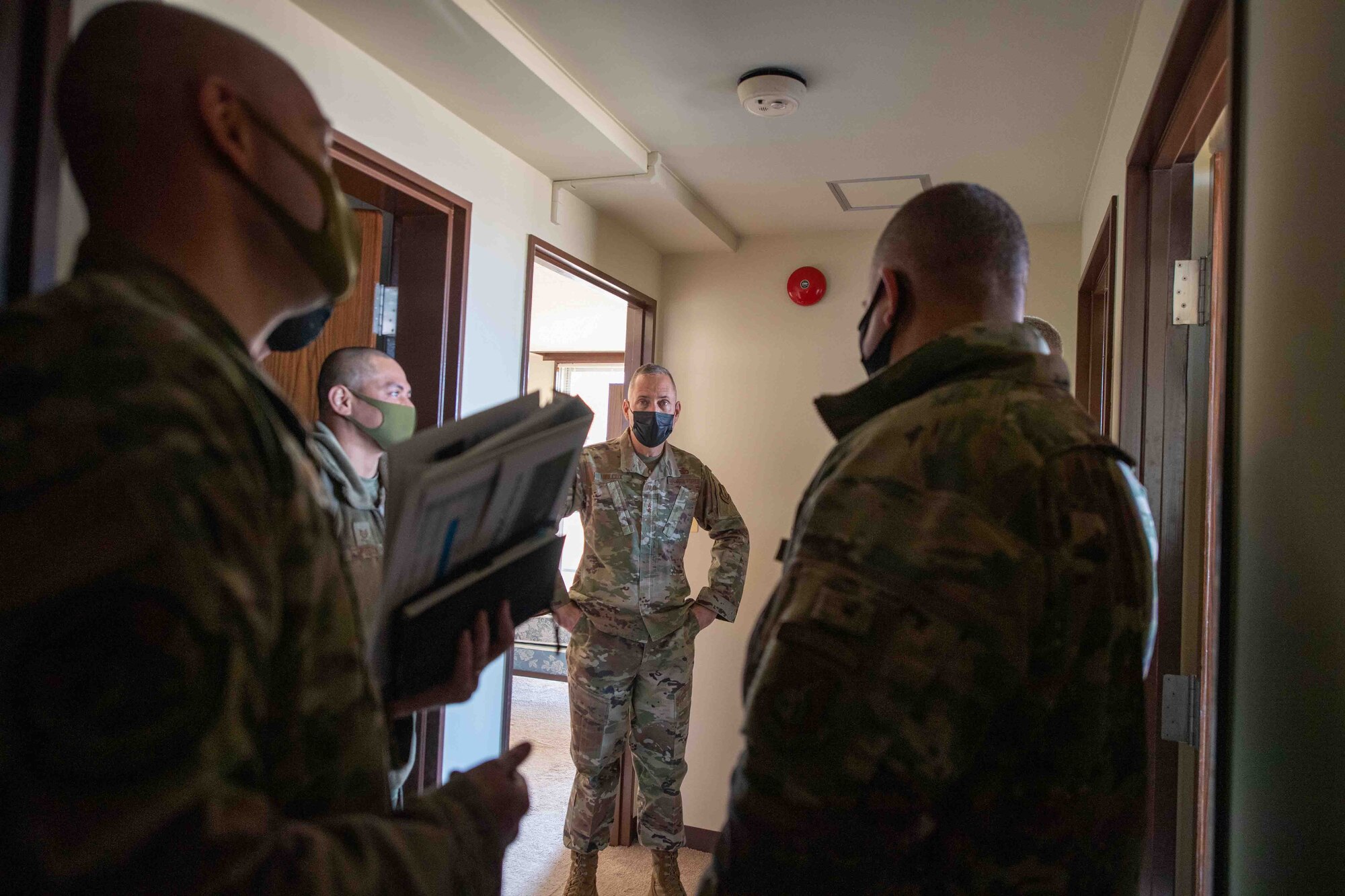 Leadership from 374th Mission Support Group brief Maj. Gen. Tom Wilcox, center, Air Force Installation and Mission Support Center commander, on the base’s contingency towers during a site visit at Yokota Air Base, Japan, Feb. 9, 2022.