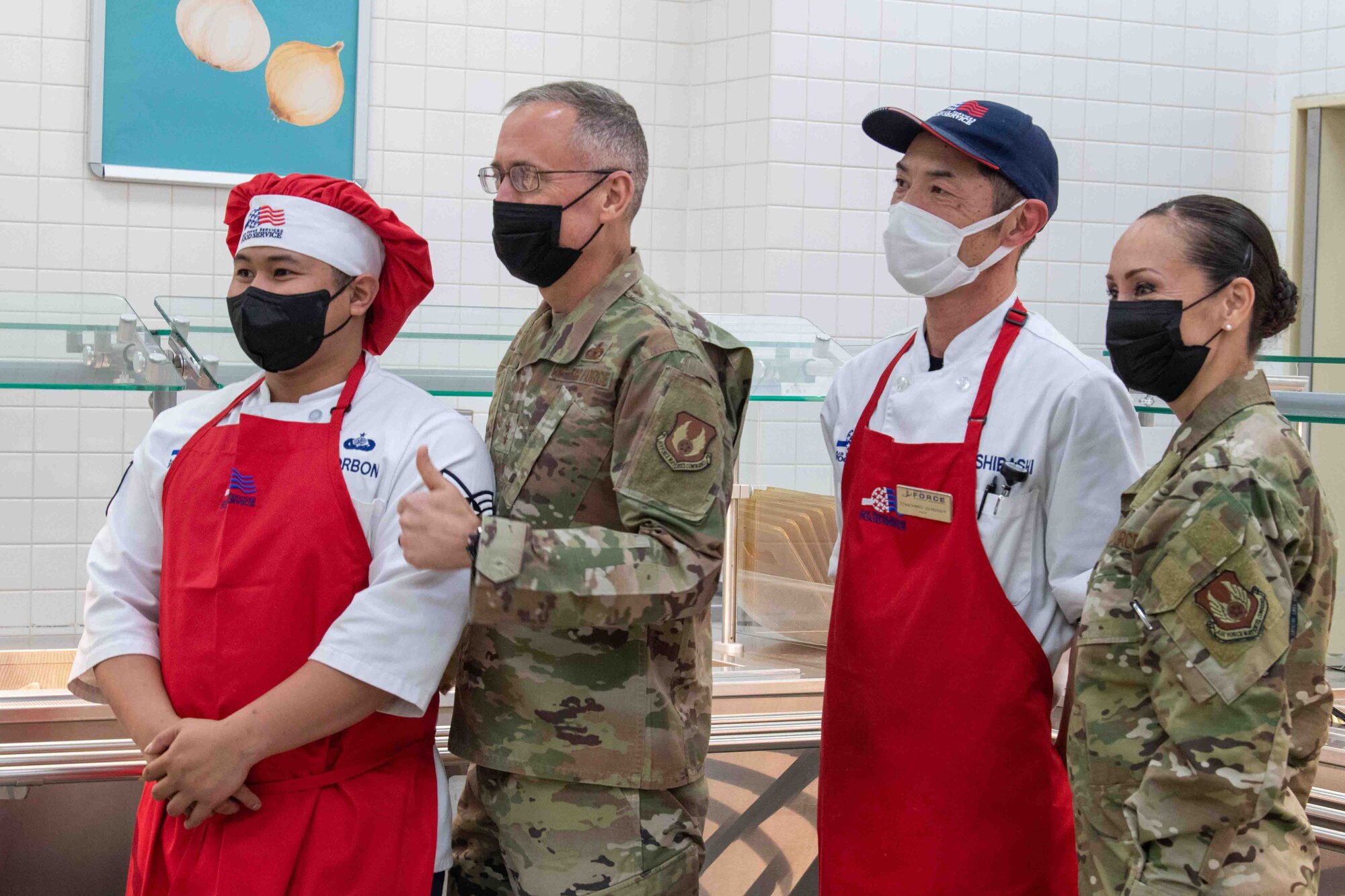Maj. Gen. Tom Wilcox, Air Force Installation and Mission Support Center commander, and Chief Master Sgt. Hope Skibitsky, AFIMSC command chief, spent time with Samurai Dining Facility staff during a site visit at Yokota Air Base, Japan, Feb. 9, 2022.