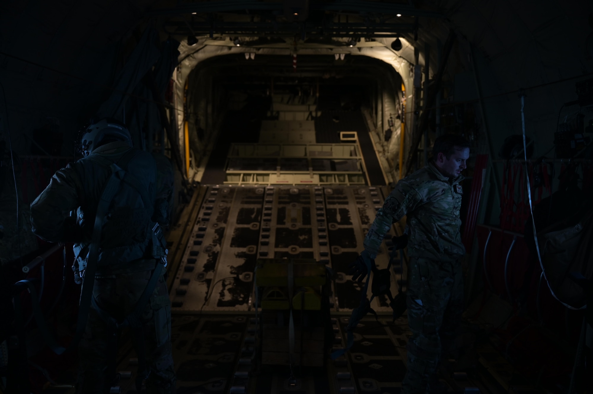 Staff. Sgt. Wesley Zech, left, and Staff Sgt. Mcarthur Posey, loadmasters assigned to the 36th Airlift Squadron, doff their gear aboard a C-130J Super Hercules near the Irozaki Cape, Japan, during exercise Tomodachi Rescue 22 Feb. 11, 2022.
