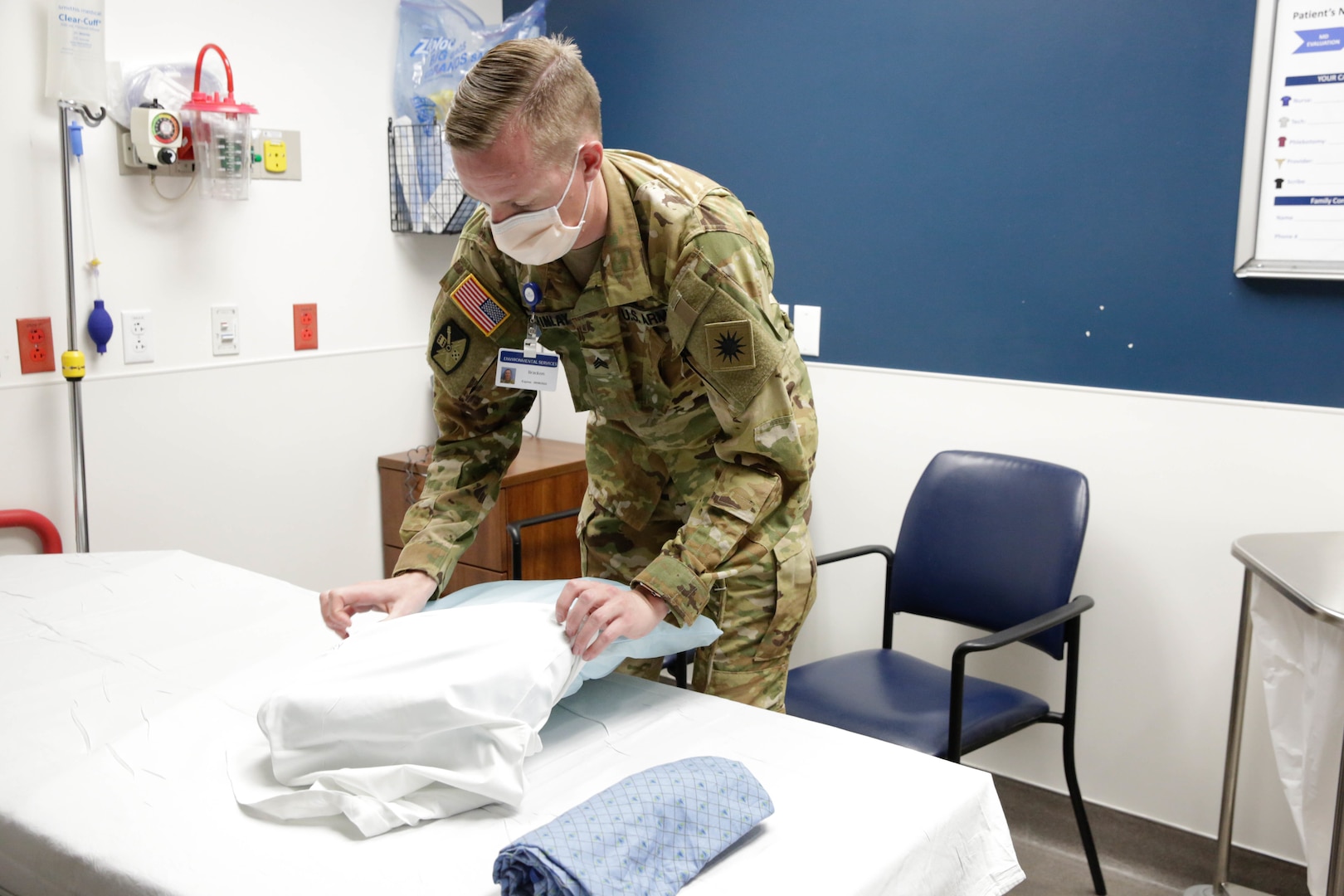 Utah National Guard Sgt. Bracken McKinlay changes sheets and cleans a room after a patient is moved out of the emergency room at St. George Regional Hospital. For the first time since the beginning of the pandemic, Utah National Guard members of the COVID-19 Joint Task Force are providing direct hospital support in non-medical roles.