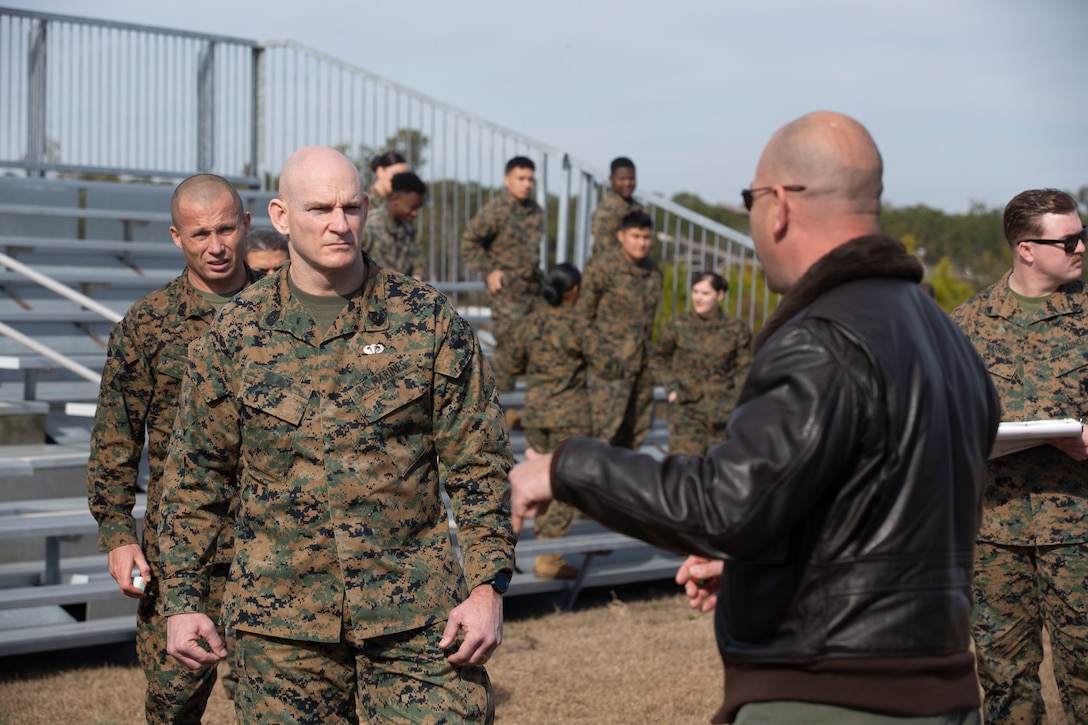 U.S. Marine Corps Sgt. Maj. Troy E. Black, the 19th Sergeant Major of the Marine Corps, receives a brief during a forward area refueling point demonstration at Marine Corps Air Station Cherry Point, North Carolina, Jan. 13, 2022. The brief was part of a three-day Sergeant Major of the Marine Corps Force Level Summit. The summits are held quarterly to support force level sergeants major at their respective commands. (U.S. Marine Corps photo by Sgt. Victoria Ross)