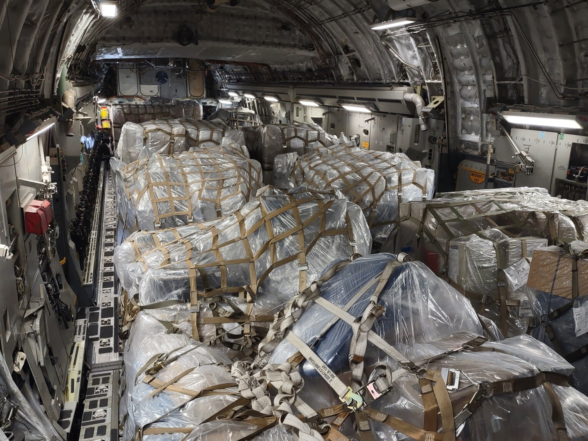 Over 27 tons of donated humanitarian cargo is pictured loaded onto 16 aircraft pallets - each the size of four standard pallets - in the cargo bay of a C-17 Globemaster III aircraft from Joint Base Charleston, S.C., Feb. 13, 2022. Air Force Reserve Citizen Airmen from the 315th Airlift Wing delivered the cargo to Soto Cano Air Base, Honduras, as part of a combined crew training and humanitarian delivery mission, where it will be distributed by Honduran outreach organizations. (U.S. Air Force photo by Capt. Justin Clark)