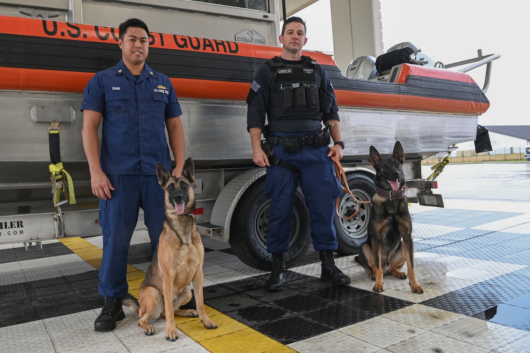 Coast Guard K9 crews pose for a photo at Maritime Safety and Security Team Houston, Texas, Feb. 3, 2022. These two K9 and handler duos make up two of the nine Coast Guard K9 crews in the Atlantic area and solely conduct explosive detection.