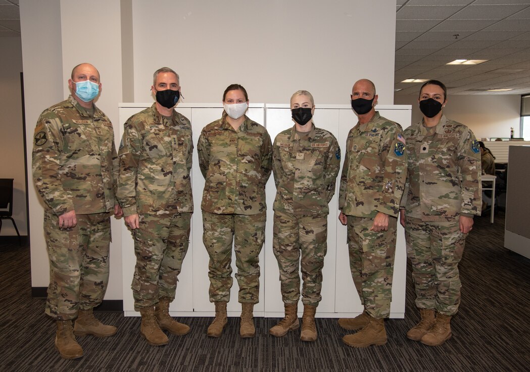 Airmen stand together for a group photo