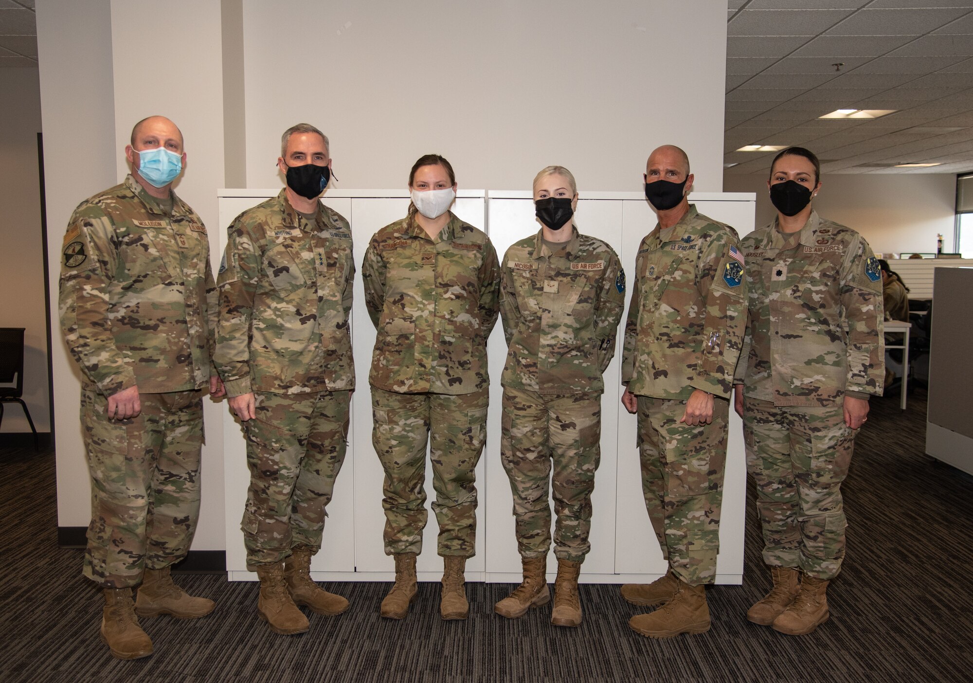 Airmen stand together for a group photo
